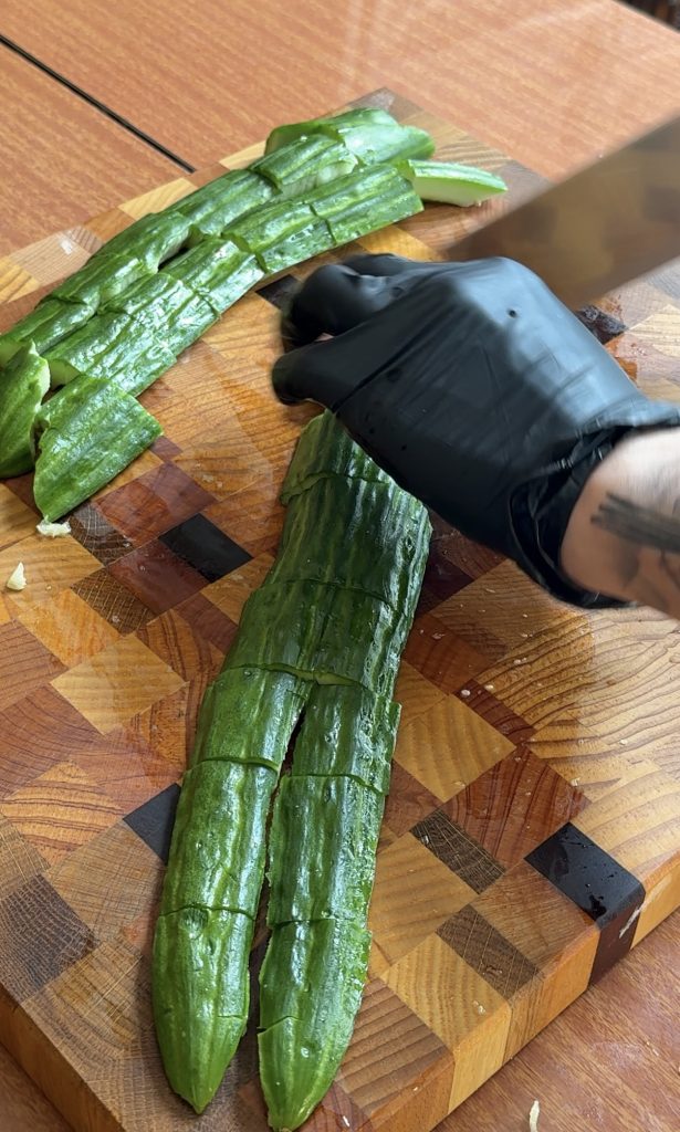 cutting cucumbers for Chinese cucumber salad