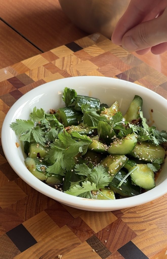 garnishing the cucumber salad for Chinese cucumber salad