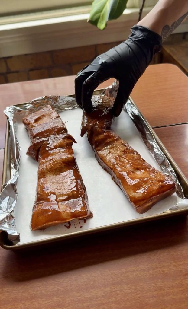pork belly on lined baking tray for The Best Char Siu Pork (Red BBQ Pork) recipe by Sam Low
