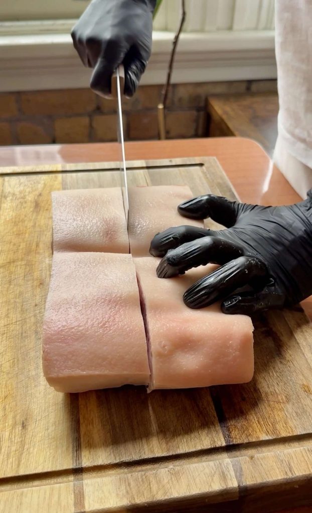 cutting pork belly for The Best Char Siu Pork (Red BBQ Pork) recipe by Sam Low
